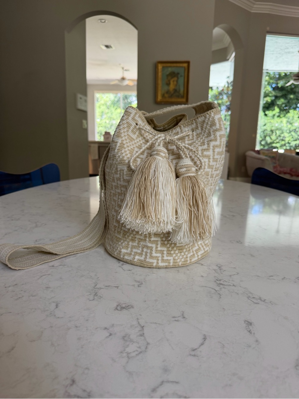 Cream Handwoven Tassel Bucket Crossbody Wayuu bag with Adjustable Strap.